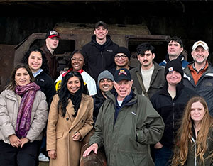 LTG (Ret) Lawson Magruder stands with students at WWII site