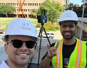 Dr. Chris Rausch and graduate student working on construction engineering project